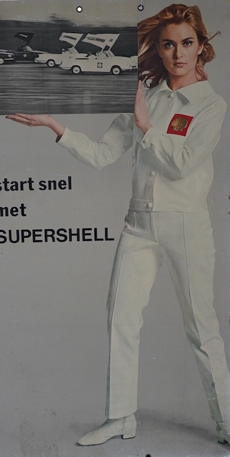 Automobilia interest; a 1970s card advertising sign for Shell Oil Supershell featuring a portrait of Alexandra Bastedo in a white suit with Shell logo, 157.5 x 80.5cm. Condition fair, some damage to the edges.